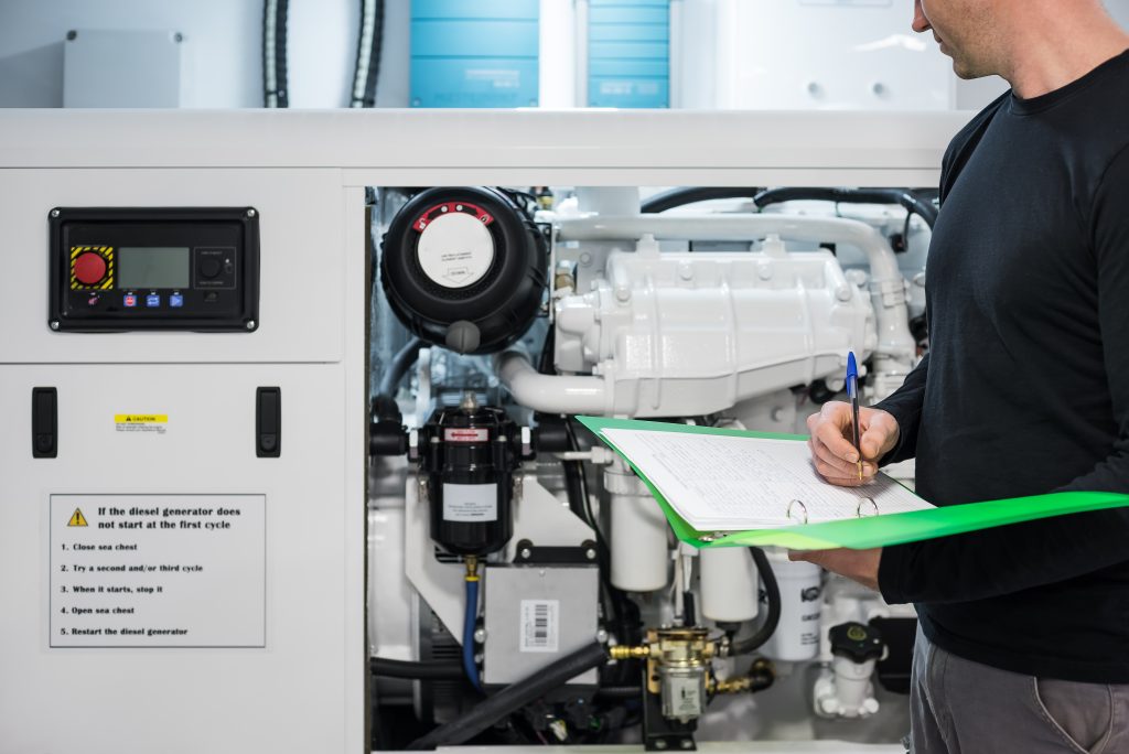 Marine engineer checking engine on Superyacht Z Approved Engine Course 1 (AEC) at the Maritime Skills Academy