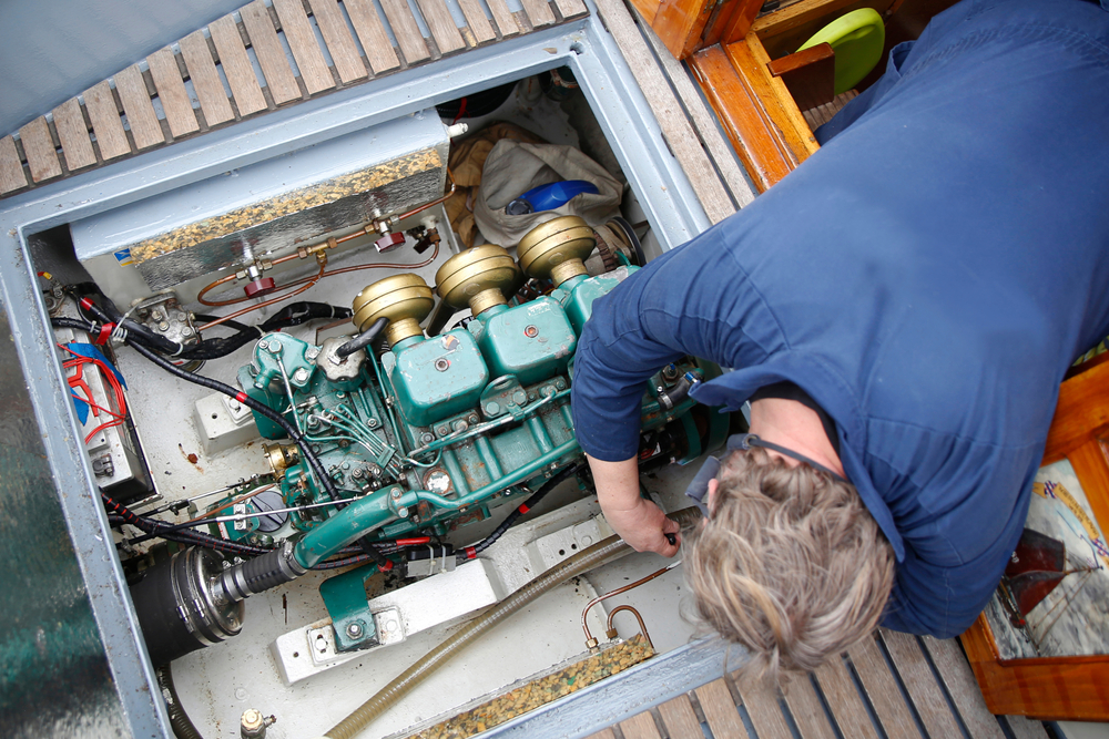 Deckhand fixing engine on a yacht | Approved Engine Course 1 (AEC) at MSA Dover